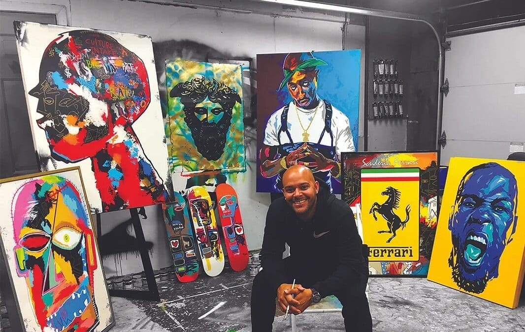 jermaine sitting among his art