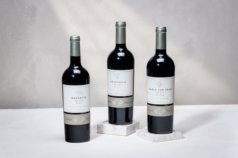Art of the Blend Trio 2026 three wine bottles on a holiday background